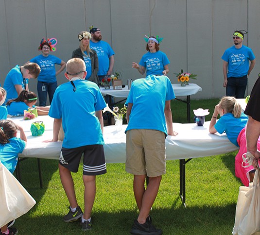 Children learning about pollinators at Tennant Kids Day