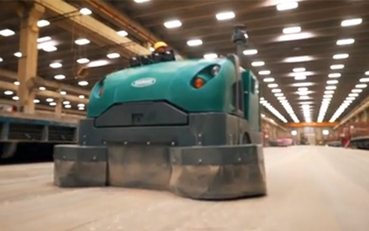 Tennant Company floor sweeper collecting silica dust with HEPA filter