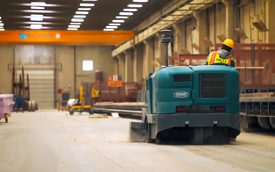 Tennant Company floor sweeper collecting silica dust with HEPA filter