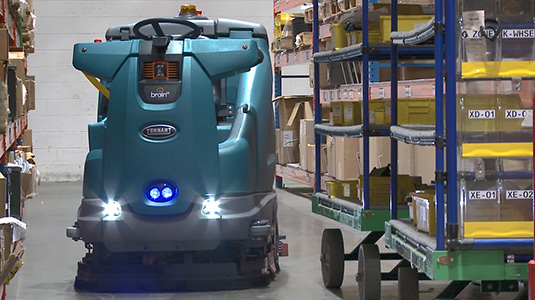T16AMR Industrial Robotic Floor Scrubber cleaning in a warehouse